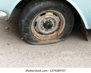 a flat tire. old retro wheel. forsaken car - Shutterstock ID 1379289707