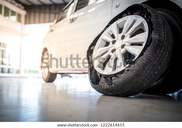 flat tires from accident, flat tires, old\
tires, Close up Flat tire and old\
car.\

