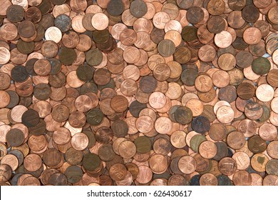 Flat view pennies. United States currency penny, many old new dirty clean viewed from directly above. The penny is the lowest denomination coin in the U.S. currency. - Shutterstock ID 626430617