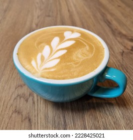 Flat white coffee with flower pattern