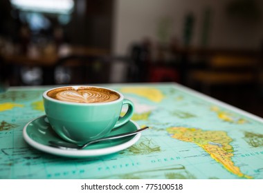 Flat White Coffee on Map Table