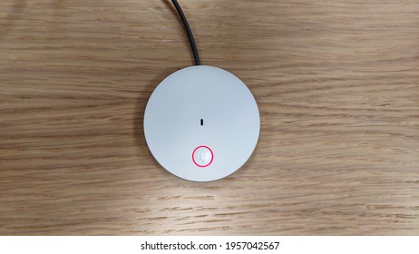 Flat white microphone on table