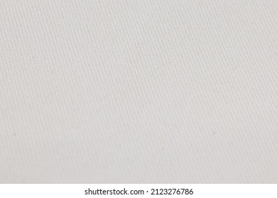 Flat white-colored fabric texture background. This flannel fabric is made of 100% polyester.