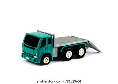 A Flatbed Towing Truck Toy On A White Background. Towing Gate Down.