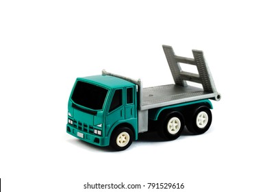 A Flatbed Towing Truck Toy On A White Background. Towing Gate Up.