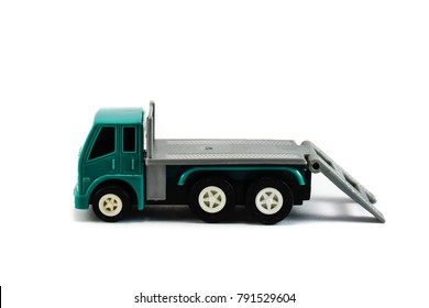 A flatbed towing truck toy side profile on a white background. Towing gate down.