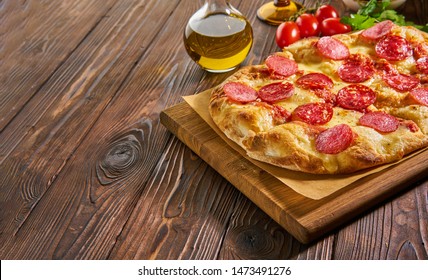 Flatbread Pepperoni Pizza On Wooden Board