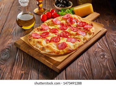 Flatbread Pepperoni Pizza On Wooden Board