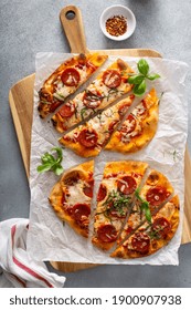 Flatbread Pepperoni Pizza Topped With Fresh Basil Sliced, Top View