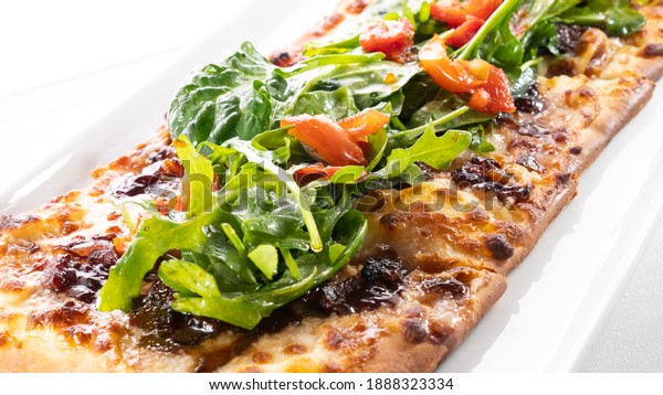 A Flatbread Pizza On Small\
Plate