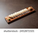 Flatfish sushi on a wooden tray