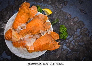 Flathead lobster shrimps on ice, fresh slipper lobster flathead boiled for cooking on white plate lemon parsley in the seafood restaurant kitchen or seafood market, Rock Lobster Moreton Bay Bug