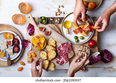 Flat-lay Of  Appetizers Table With Italian Antipasti Snacks. Family, Friends Holiday Gathering, Wine And Snacks Party. Brushetta Or Authentic Traditional Spanish Tapas Set Over Wooden Background. 