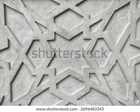 Flat-lay background of an Islamic geometric pattern carved into raw, grey concrete. The intricate, repeating lines and stars create a modern, minimalist texture. Perfect for Islamic architecture