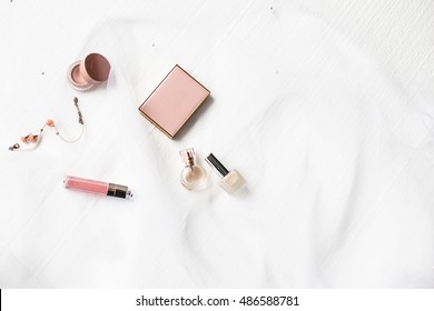 Flatlay Of A Beautiful Fashion Bride Accessories, Sweet And Sensual. Wedding Make Up Cosmetic Items Top View. Veil On White Background. Art Modern Style. 