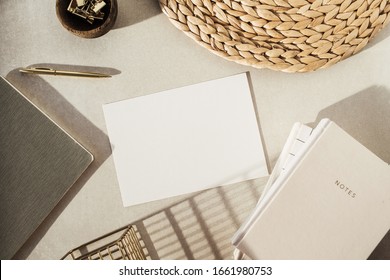 Flatlay blank paper sheet, notebooks, clips in wooden bowl, straw stand on beige concrete background. Home office desk workspace. Business, work template. Flat lay, top view. - Shutterstock ID 1661980753