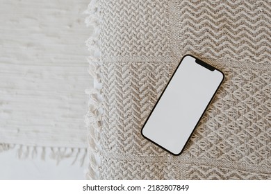 Flatlay Of Blank Screen Mobile Cell Phone On Wicker Bench. Aesthetic Flat Lay, Top View Blog, Social Media, Template.