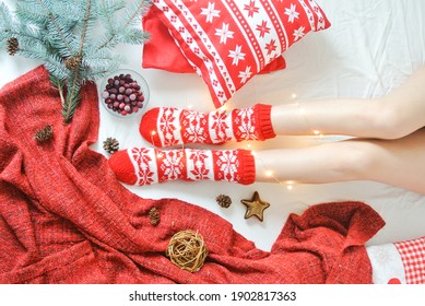 Flatlay Christmas Socks On The Legs And Pillows