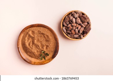 Flatlay Cocoa Beans, Cocoa Powder On A Pink Background. The Concept Of Healthy Eating. 