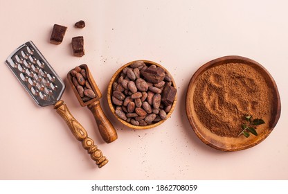 Flatlay Cocoa Beans, Cocoa Powder, Raw Chocolate On A Pink Background. The Concept Of Healthy Eating. 