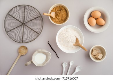 Flatlay Collection Of Tools And Ingredients For Home Baking On Light Grey Background Shot From Above