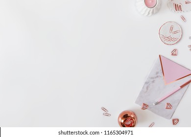 Flatlay Desk Table. Workspace With Modern Pink And Marblre Notebooks And Decorations, Candle And Office Tools On White Background. Copy Space, Top View. Feminine Concept