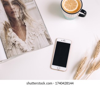 Flatlay Of Iphone And Fashion Magazine On White Background, Morning Concept, Planing The Day During Morning Routine