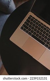 Flatlay of laptop computer on black table. Work at home, freelance, online shopping, blog, social media branding concept
