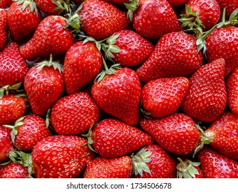 Flatlay from a large number of strawberries. Natural background.