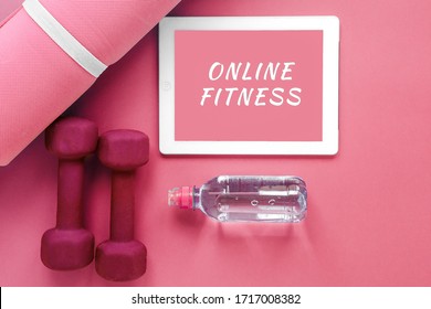 Flatlay Pink: Tablet With The Inscription Online Fitness, Sports Mat, Dumbbells And A Bottle Of Water