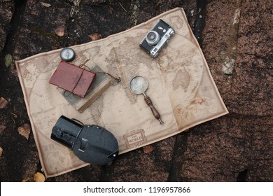 Flatlay with travel things - map, flask, book, compass