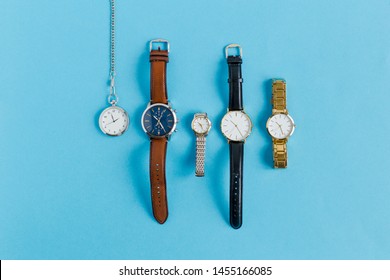 Flatlay Watch On Blue Background, Many Watch. Copy Space. Timeless Concept
