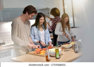 Flatmates Cooking Together At Home