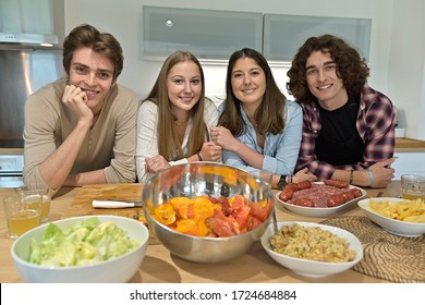 Flatmates enjoying cooking together at home