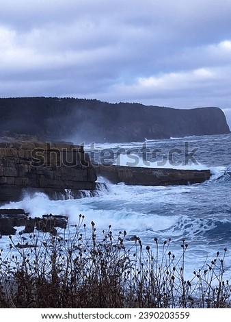 Flatrock, Newfoundland
angry ocean breaking against rugged rocks. 