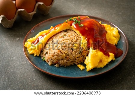 Flavored Fried Rice in an Omelet Wrapping or Omurice in Japanese style - Asian food style