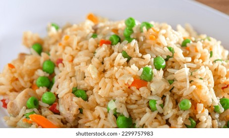Flavorful Fusion: Top-View Close-up of Chicken Fried Rice Infused with Vibrant Vegetables
