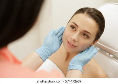 Flawless Face. Professional Cosmetologist Examining Face Skin Of Her Beautiful Young Female Client Beauty Consultation Therapist Perfection Skincare Youth Professional Professionalism Service Concept