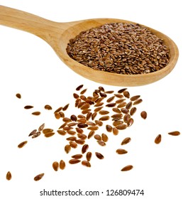 flax seed linseed in wooden spoon closeup isolated on white background