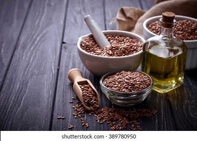 Flax seeds and linseed oil. Selective focus