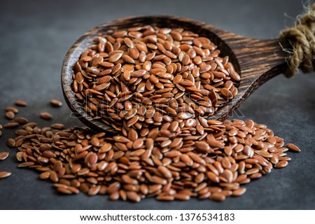 Flax seeds on wooden spoon