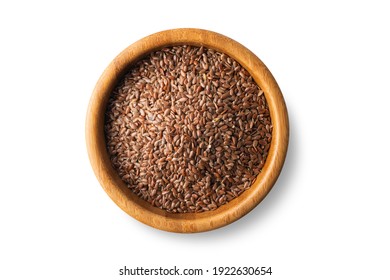 flax seeds in a wooden bowl on a isolated on a white background, top view