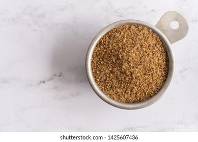 Flaxseed Meal In A Measuring Cup