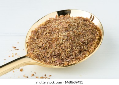 Flaxseed Meal On A Gold Spoon