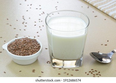 Flaxseed Milk In A Glass Cup With Flaxseeds In A Bowl