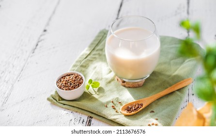 Flaxseed Milk In Glass On Light Green Napkin, Flax Seeds, Mint Leaves. Copy Space