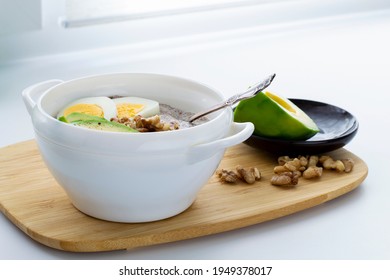 Flaxseed Porridge With Avocado And Egg. Detox Breakfast. Healthy Anti-age Porridge