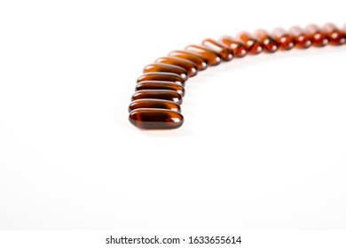 Flaxseed Softgels On White Background