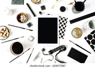 Flay Lay Composition For Bloggers, Artists, Magazines And Social Media. Freelancer Black Style Workspace With Tablet, Black Coffee, Sketchbook, Napkins, Ribbons, Paintbrushes On White Background.