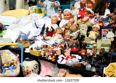 Flea Market Booth With A Huge Variety Of Toys And Dolls